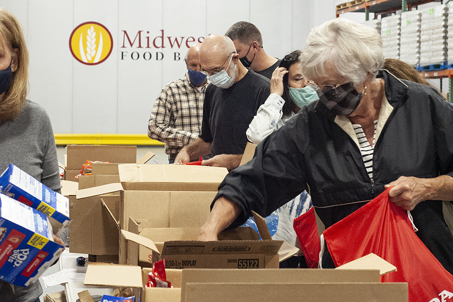 A group packs Hope Packs at Food Bank in Bloomington, IL