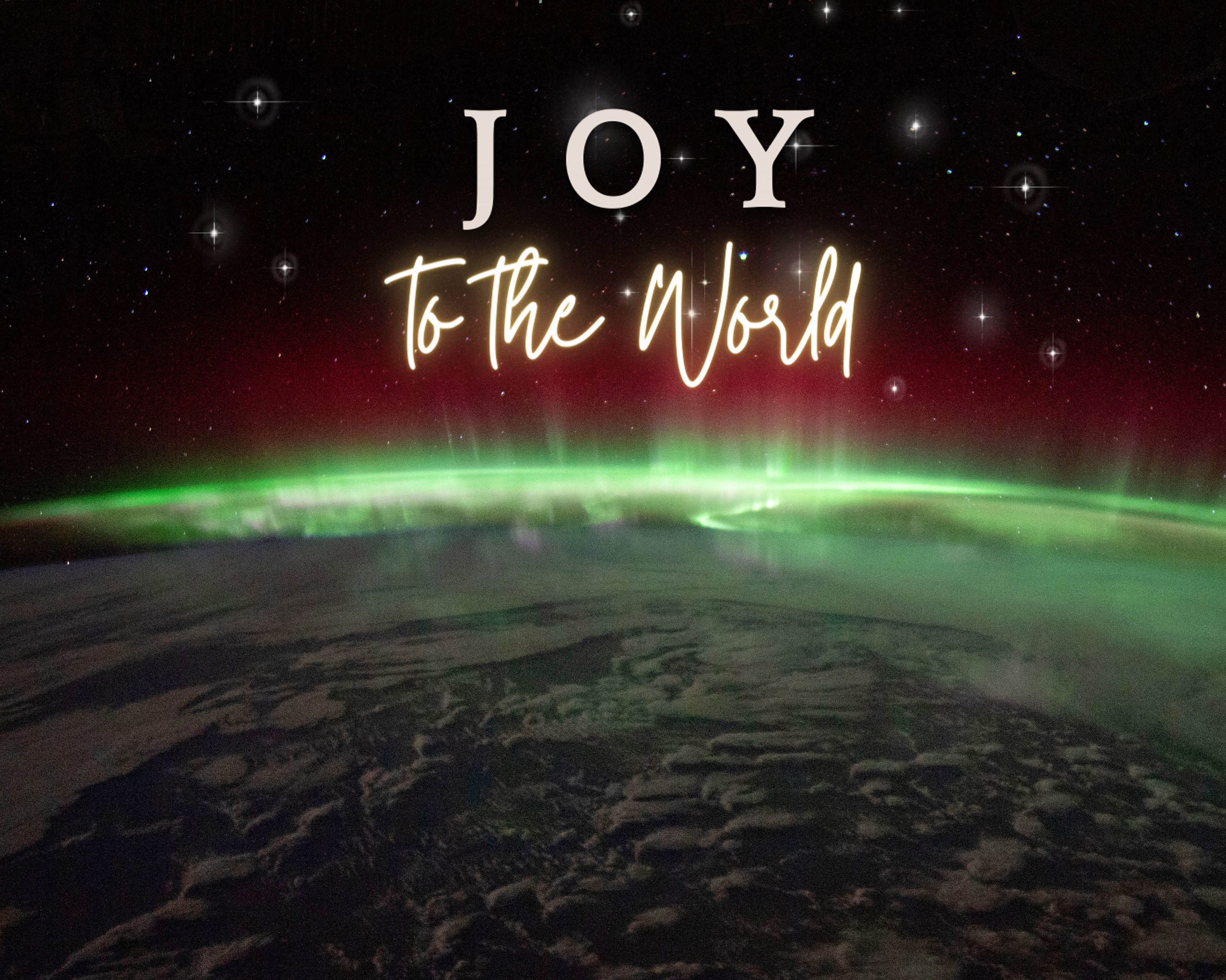 Joy to The World text overlay on aurora announcing Advent Faith Lutheran Church of McLean County