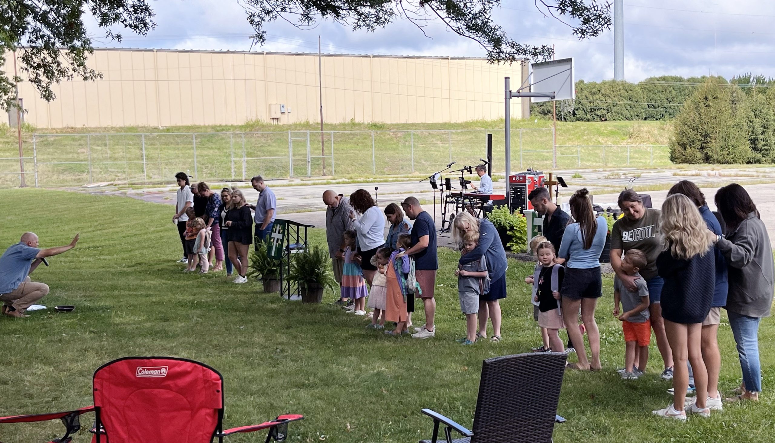 Students of all ages staning in a line during Backpack blessing at Faith Lutheran Church of McLean County in Bloomington Illinois