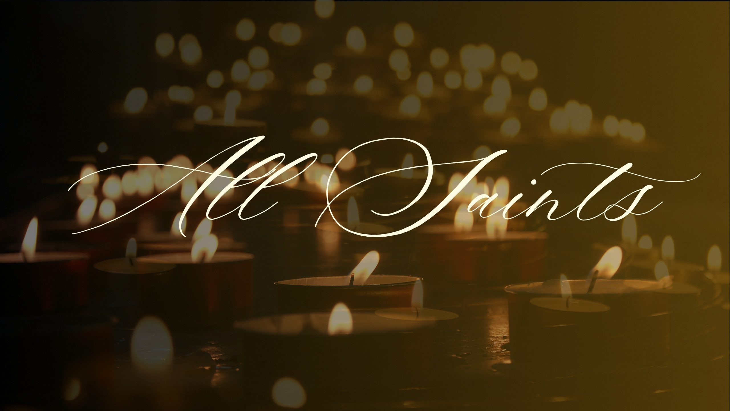 "All Saints" script text overlays a dark photo of numerous lit candles emitting soft light filling the image