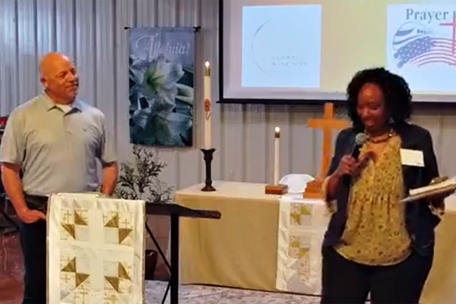 photo of Faith Lutheran Church Partner Pat present in front of an altar to the congregation about Light Global Mission's Prayer Train Across America.